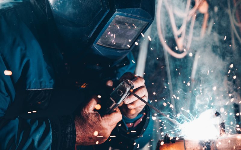 man using welding machine