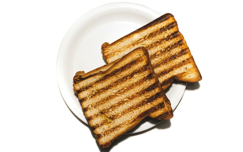 brown and black bread on white ceramic plate